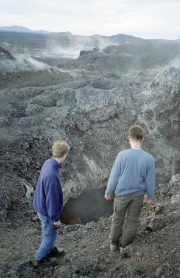 Dave and Gordon investigating a crater with steam rising from it