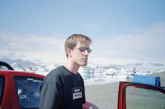 Dave standing by the car wearing his sunglasses