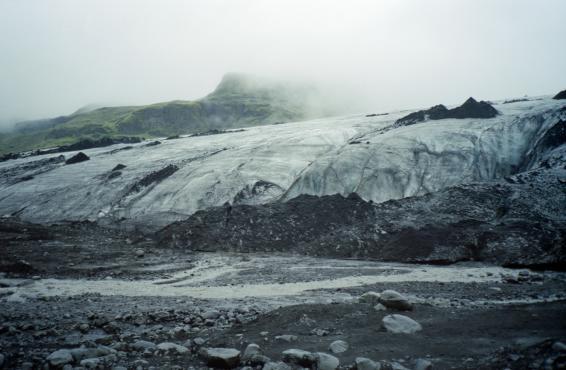 The edge of the Sólheimajökull glacier, covered in dust and ash