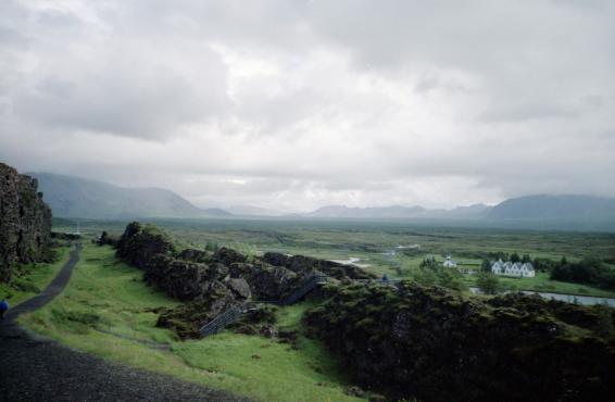 A view over the plains at Þingvellir from just above the lake, showing the houses and the mountains